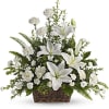 White lilies and carnations in a wicker basket