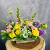 Take a stroll through a country flower garden with this lovely arrangement