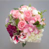 Crowd-pleasing Dahlias, championed pink Peonies and frosty Dusty Miller compose this choice