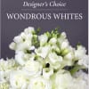 A lush cluster of pure white blooms designed to soothe and celebrate