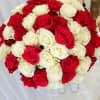 Large bouquet of red and white roses held by a person
