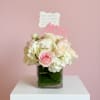 Blush roses and white hydrangeas designed in a modern cube vase with