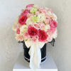 A lush pink and ivory hat box arrangement designed with soft romantic