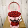 Cute suitcase style box filled with premium red roses. Includes mini drawer