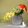 yellow roses with orange tips  green cymbidium orchids and yellow dendro