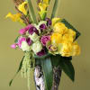 yellow and purple mini calla lily's, yellow and green roses, pink mini