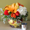 bubble bowl clear with red and yellow rose petals inside, orange lily's