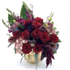 Gorgeous red Ecuadorian roses with a beautiful mix of complimenting flowers arranged