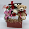 Gift box with red roses, pink lily, and teddy bear