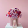 A luxe pink and lavender floral hat box with pearl accents and