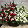 25 red roses 25, white dendro orchids, white cymbidium orchids, and gladiolus.