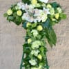 A variety of foliage and green orchids.