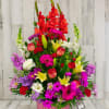 Bright, happy, cheerful colors of spring flowers arranged in a basket. Arrangement