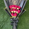 Bouquet of pink roses with chocolates and a Father’s Day card