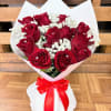 Bouquet of red roses with white baby's breath and a red ribbon