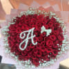 Bouquet of red roses with white baby's breath in pink wrap