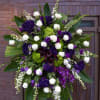 Large standing floral spray with white and purple flowers