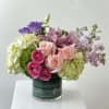 Mixed pink and purple bouquet in a glass vase