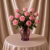 A delicate and elegant floral arrangement designed with 12 premium baby pink