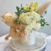Our "Rozella's" box, with giraffe teddy. neutral colors, mixed flowers. 