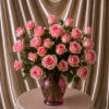 A stunning luxury floral arrangement featuring 24 premium baby pink roses thoughtfully