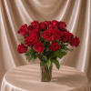 Classic and timeless floral arrangement designed with 12 premium red roses accented