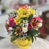 Mix of flowers in a mug.