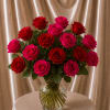 A striking floral arrangement designed with 12 premium roses featuring a romantic