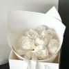 A refined blend of textures: cloud‑soft white peonies wrapped in crisp white