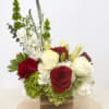 Red and white roses with white hydrangeas in a wooden box