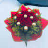Red rose bouquet with gold-wrapped chocolates and red paper wrap