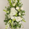 A timeless expression of peace and remembrance, this standing spray features a