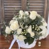 White basket with fresh white roses perfect bouquet to express your love.