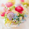 Blurred pastel bouquet with pink, yellow, and blue flowers