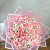 Pink rose bouquet wrapped in translucent pink paper