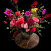 Bold, garden-fresh color greets the recipient with this lively flower arrangement-perfect as