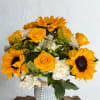 Bright yellow sunflowers take center stage in this cheerful birthday bouquet, paired