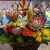 Large basket with Proteas, roses and other tropical flowers.