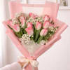 Soft pink tulips make a gentle statement in this spring-ready flower arrangement-perfect