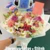 Bouquet of mixed flowers with a Stitch plush toy and a card