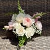 A low glass bowl is brimming with an assortment of pink and