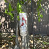 Cardinal memorial wind chime hanging outdoors