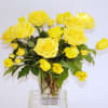 Yellow roses arranged in a clear glass vase