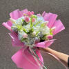 Pale blue hydrangeas paired with pink and white tulips create a soft