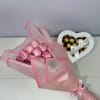 Delicate blush roses wrapped in soft pink paper and paired with a