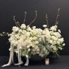 White Elegance boasts a captivating blend of Blossoms, White Tulips, Roses, Ranunculus