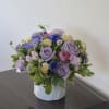 In the 'Mauve Mist' arrangement, a dreamy fusion of delicate hues unfolds
