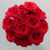 Bouquet of red roses in a tight round cluster