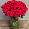 Large bouquet of red roses in a clear glass vase