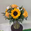 A charming arrangement with bold golden hues and soft accents, arranged in